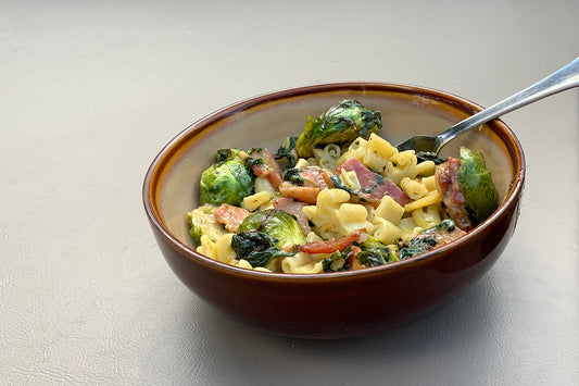 Bowl of Dagostino Fleur de Lis Pasta Salad with Bacon and Brussel Sprouts
