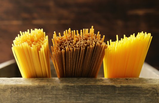 Fresh uncooked pasta, three different types of spaghetti