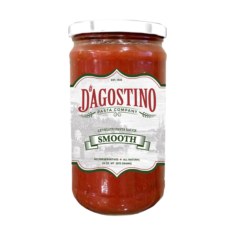 Close up of a jar of Dagostino Smooth Tomato Sauce against a white background.